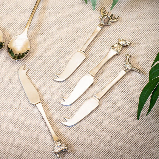 A set of 4 mini cheese knives from the Country Animals collection, each featuring a unique animal design on the handle, including a stag, pheasant, rabbit, and Highland cow. These beautifully crafted knives are perfect for serving cheese with a rustic, countryside charm.