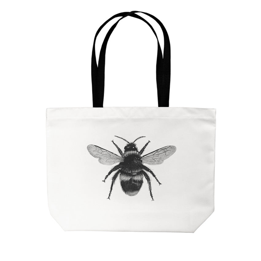 Bee Tote Bag From Libra Fine Arts. A stylish tote bag featuring a hand-drawn design of a charming rhino . Made from high-quality materials, this bag is both practical and eye-catching, perfect for christmas presents and birthday presents for everyday use or as a unique gift for animal lovers and fans of bumblebees