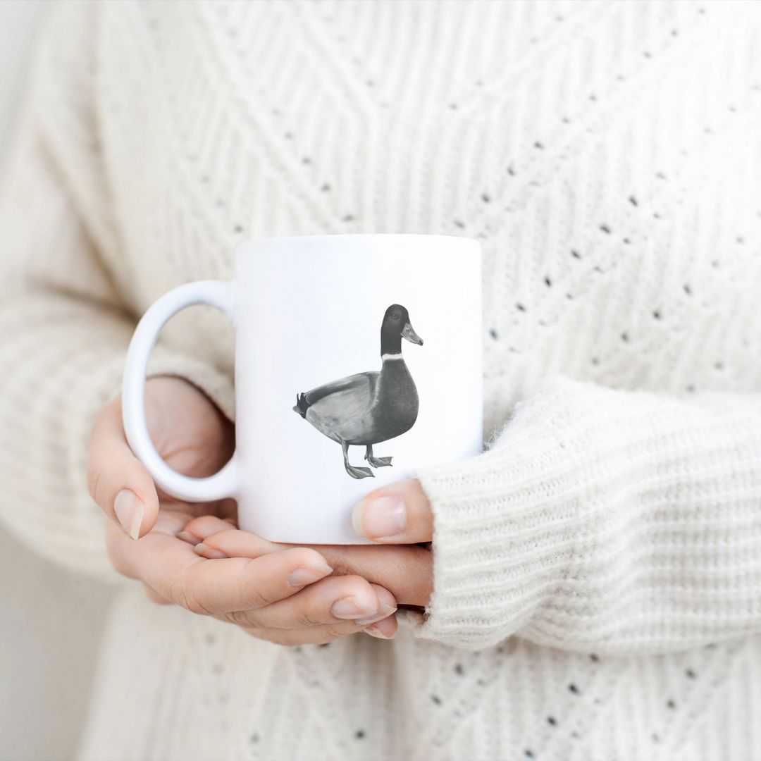 Duck 11oz Ceramic Mug From Libra Fine Arts.  Hand-drawn cute duck design ceramic mug, the perfect gift for family members, featuring intricate artwork and a personal touch. Great birthday present and christmas presents for those who love ducks and other british countryside animals