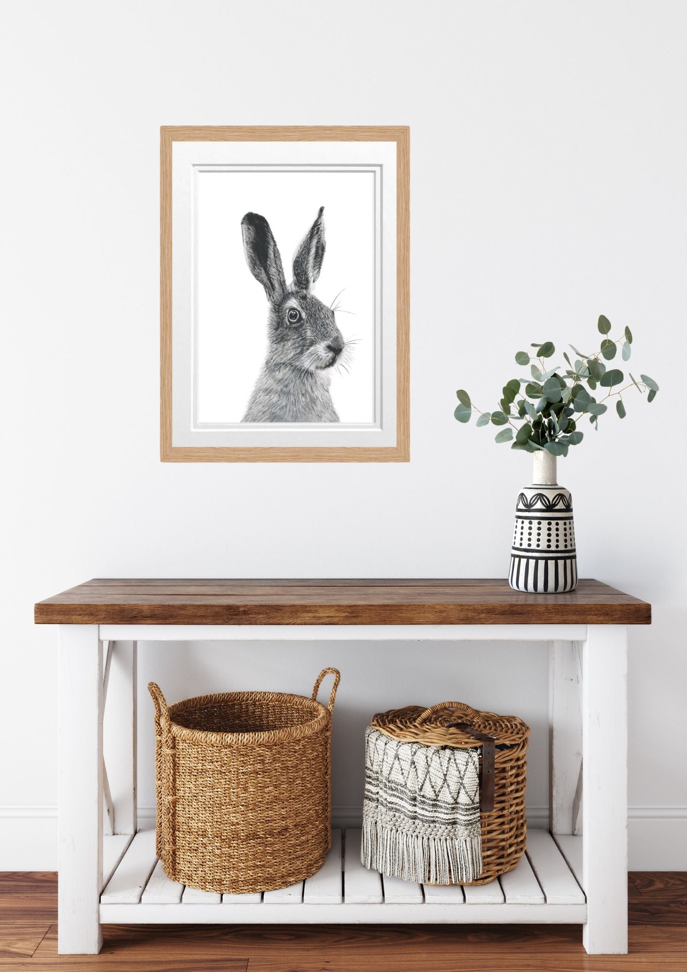 Libra_Fine_Arts_Hand_Drawn_Hare_Drawing_in_oak_Frame_hanging_on_the_wall_on_entrance_hall_above_side_table_with_baskets_and_vase.__._A_beautiful_gift_for_hare_lovers. for birthday presents or christmas gifts.