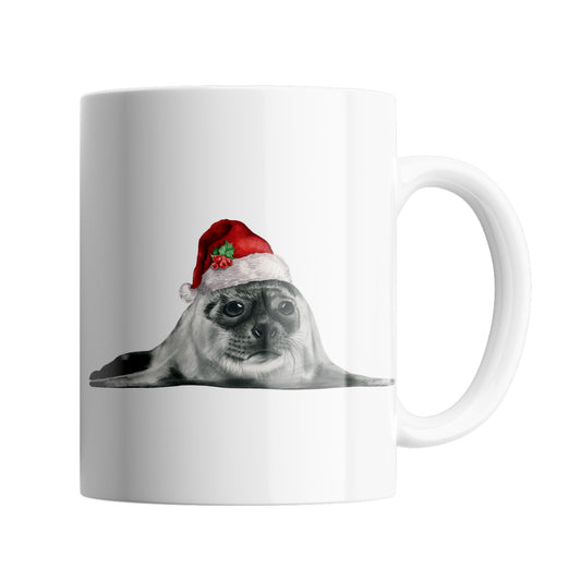 Seal 11 oz Ceramic Mug From Libra Fine Arts. A fun Christmas mug featuring. a hand drawn seal with red santa hat, perfect stocking filler or secret santa gift or present. A great christmas present for seal lovers and sealife fans