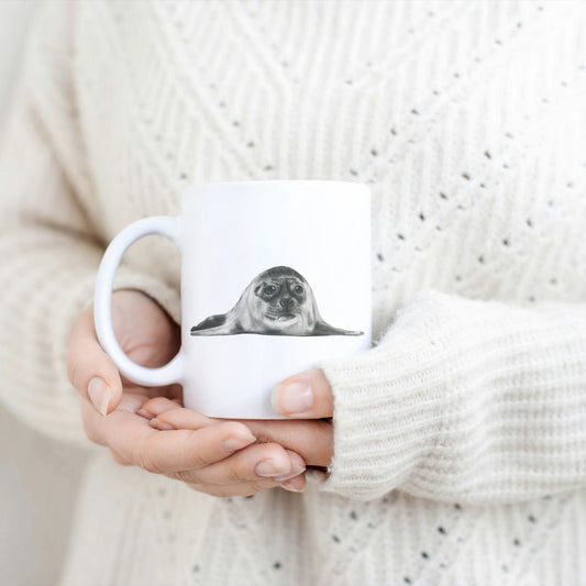 Hand-drawn countryside seal design ceramic mug, the perfect gift for family members, featuring intricate artwork and a personal touch. Great birthday present and christmas presents for those who love seals and the sealife