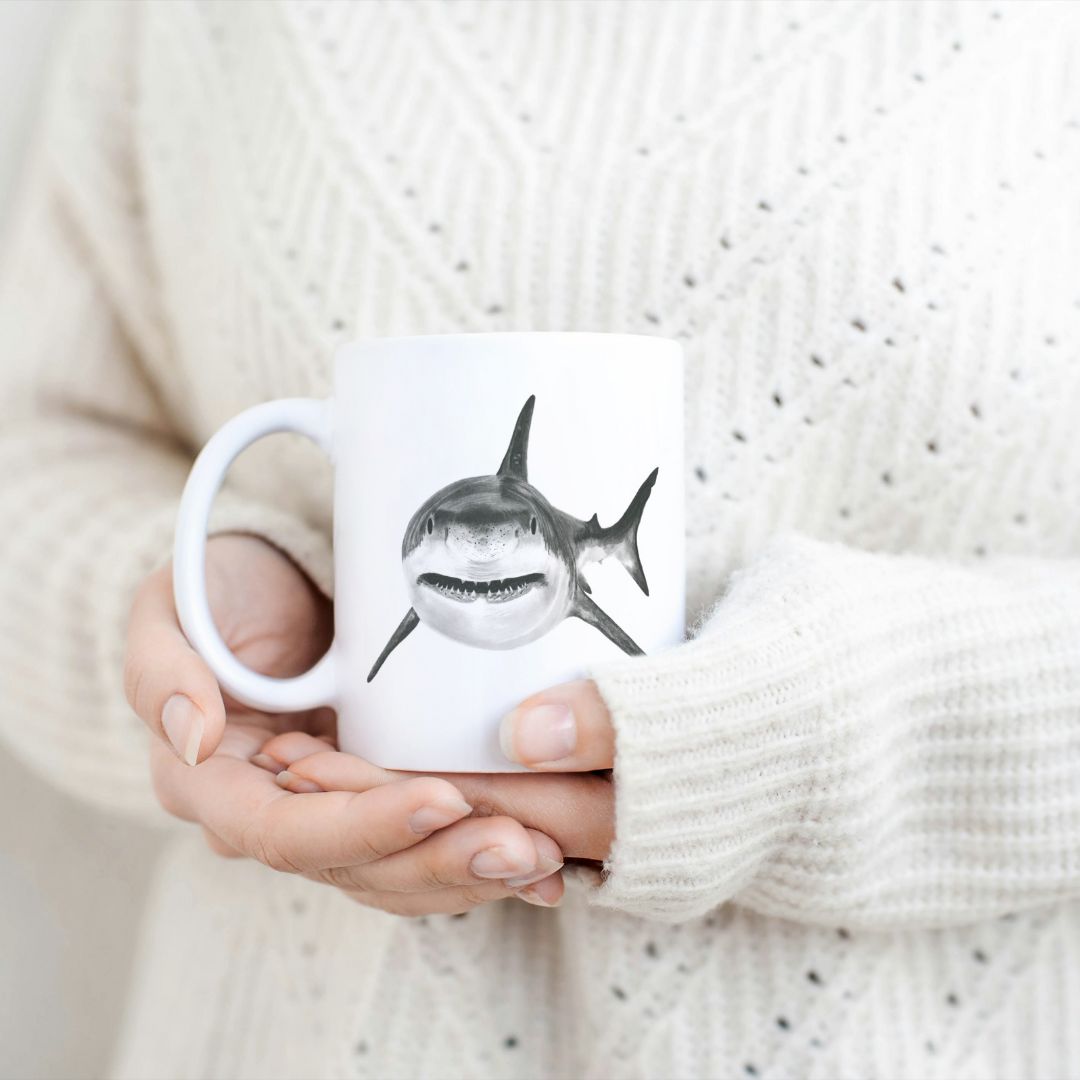 Shark 11oz Ceramic Mug From Libra Fine Arts.  Hand-drawn cute adorable  popular shark cow design ceramic mug, the perfect gift for family members, featuring intricate artwork and a personal touch. Great birthday present and christmas presents for those who love sharks and other sealife