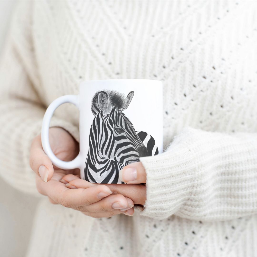 Zebra 11oz Ceramic Mug From Libra Fine Arts. Hand-drawn striking zebra design ceramic mug, the perfect gift for family members, featuring intricate artwork and a personal touch . . Great birthday present and christmas presents for those who love zebras and other wildlife