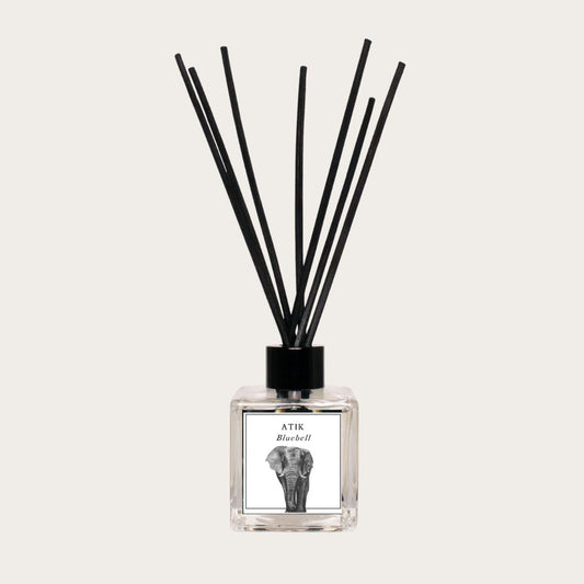 A Bluebell Natural Reed Diffuser with delicate reeds placed in a glass bottle, emitting a fresh and calming fragrance, perfect for creating a relaxing atmosphere in any room