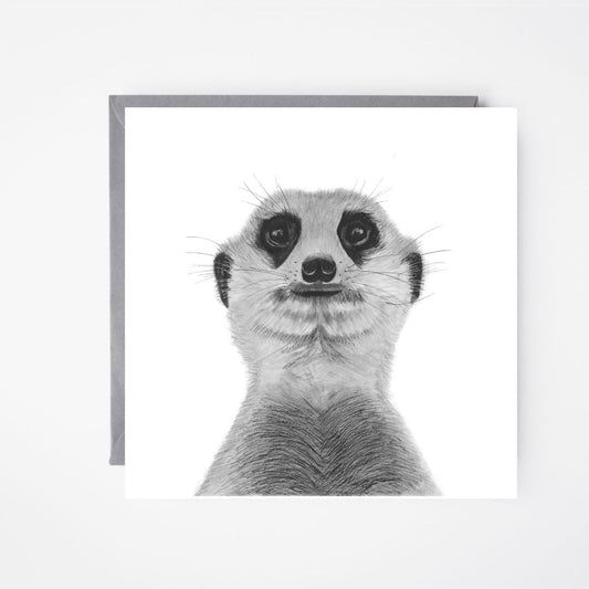 A hand-drawn Myra the Meerkat wildlife greeting card, laid flat beside a grey envelope. A perfect choice for wildlife lovers, animal enthusiasts, and those who appreciate unique artwork. Printed on Libra Fine Arts FSC-certified cardstock, ensuring a high-quality, sustainable feel. Blank inside, ready for a thoughtful message.